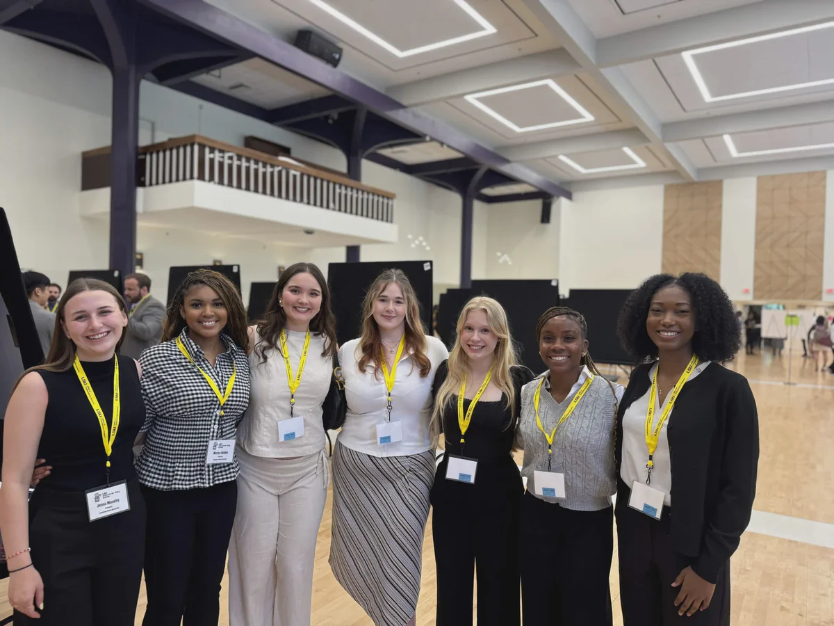 Students and mentors smiling together at Discover Day.