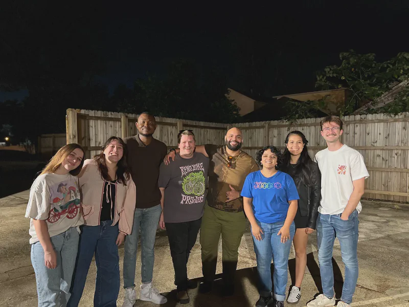 The group posing outdoors after a lab dinner.