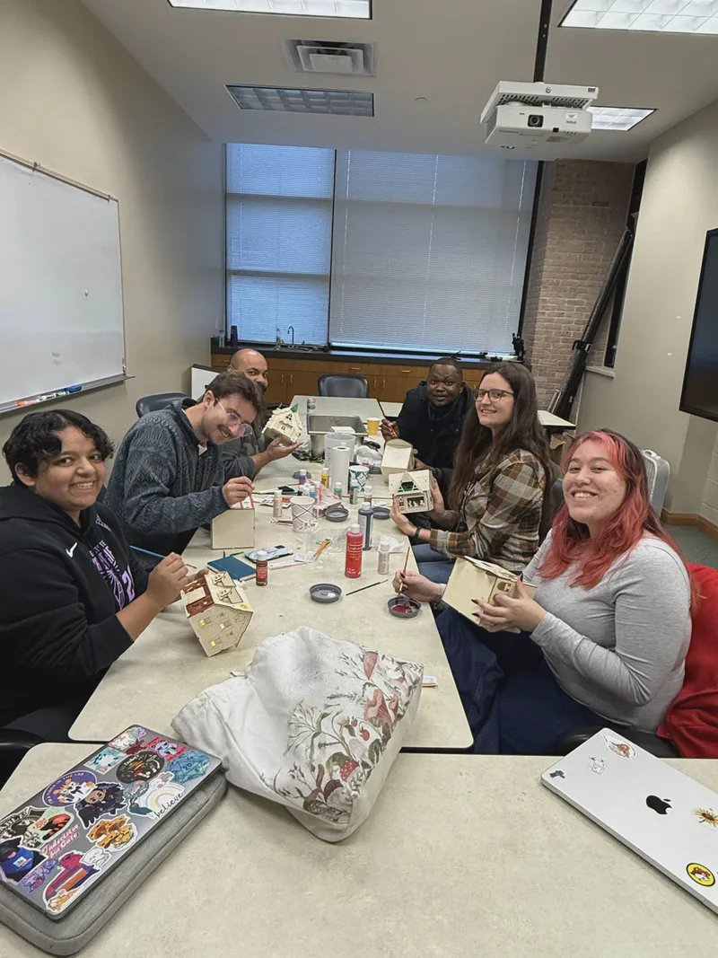 Lab members gathered around a shared table.
